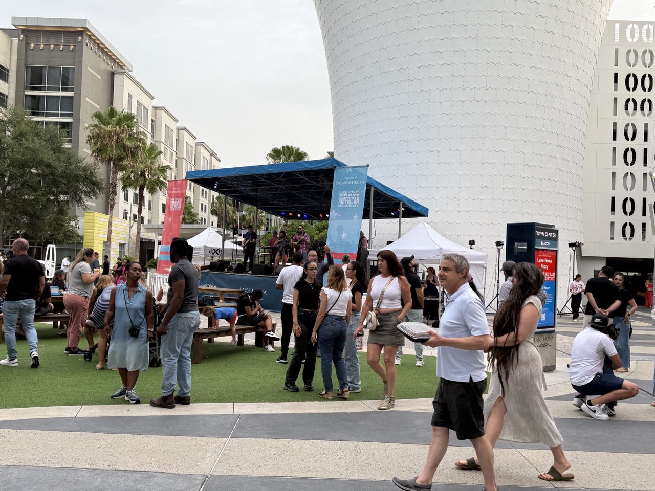 Lake Nona Town Center — daytime crowd with live entertainment and food vendors