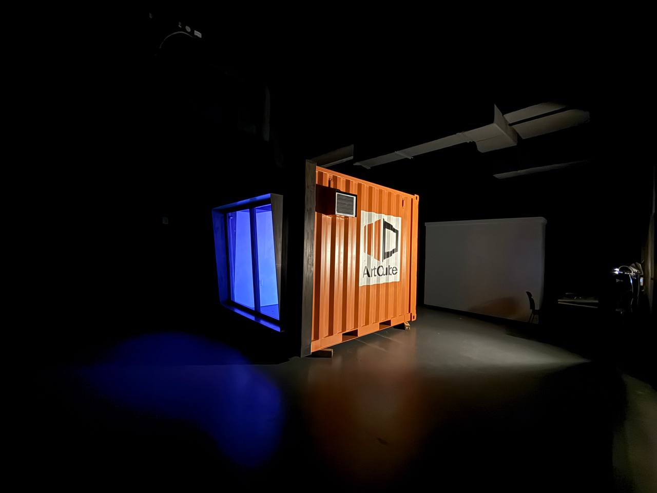 ArtCube exterior with blue glow from projection system